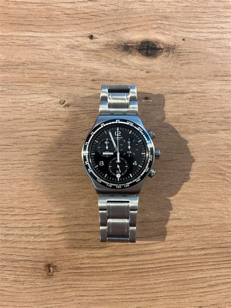 swatch night flight vs speedmaster